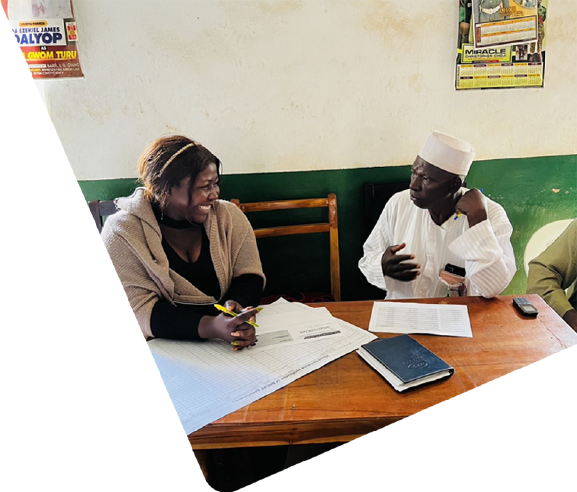 Two Nigerian officials sitting and talking