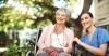 Nurse smiling with older woman