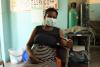 Joana pregnant with her fourth child, waiting in a clinic in Mozambique.