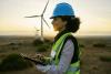 Electrician or technician person in sunset nature for wind turbine and eco environment future maintenace